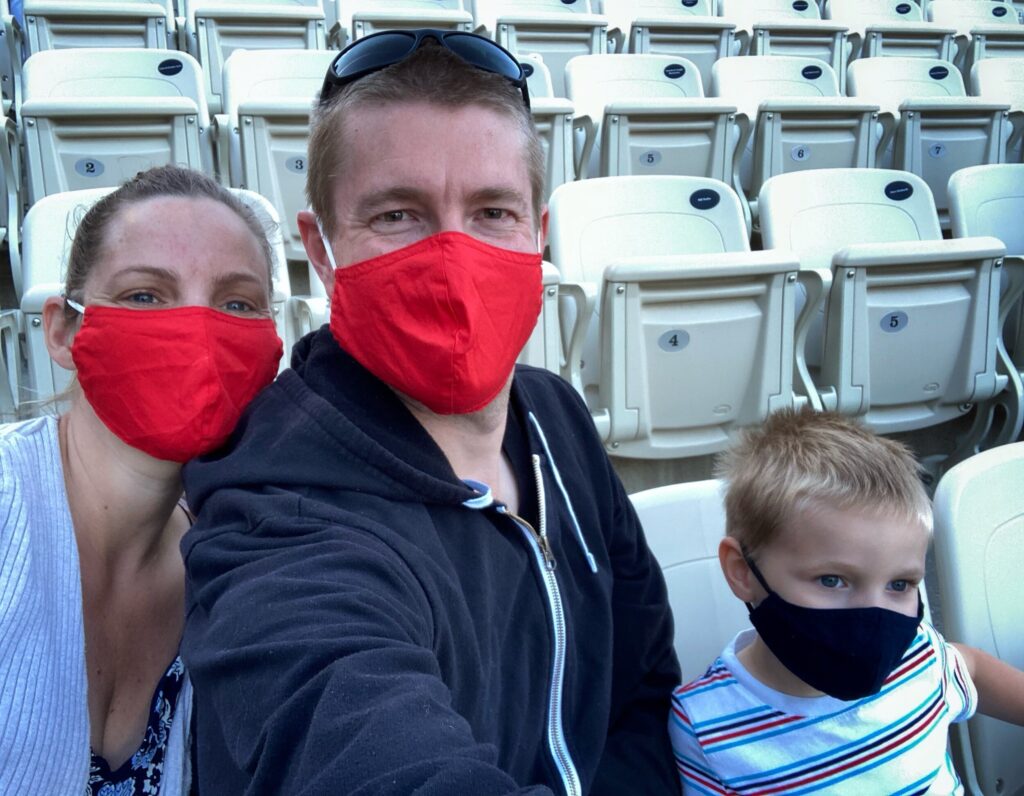 Family in seats with masks on