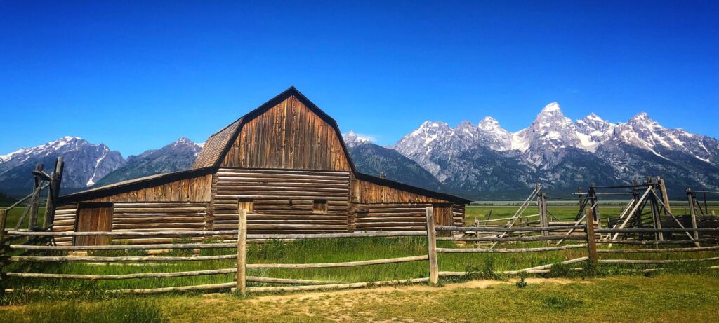Barn in front of mountains