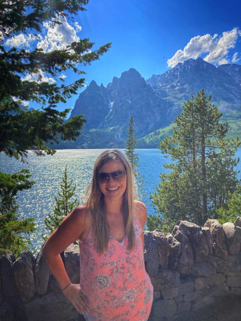 Kristy in front of lake and mountains