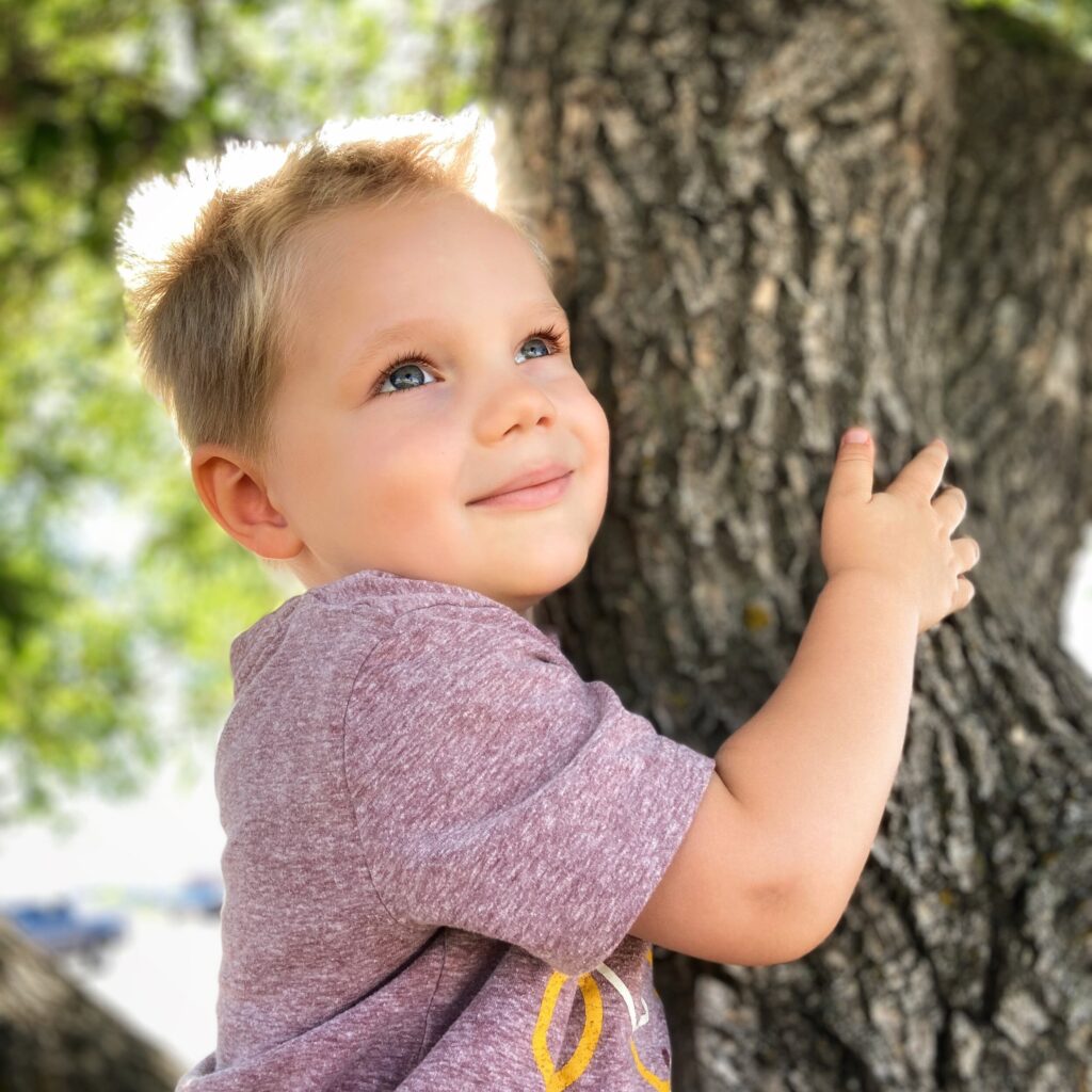 Owen hugging a tree